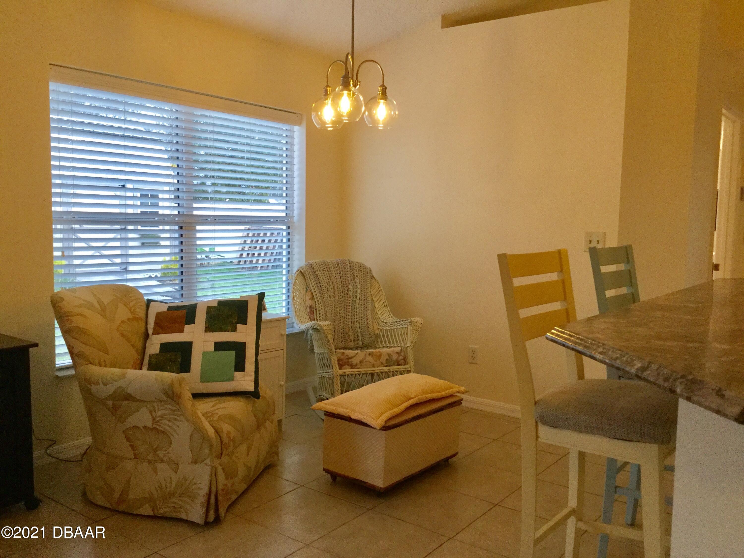 40 Riverside Lane Palm Coast, FL 32164 - Photo 35 of 47 a bedroom with furniture and a window