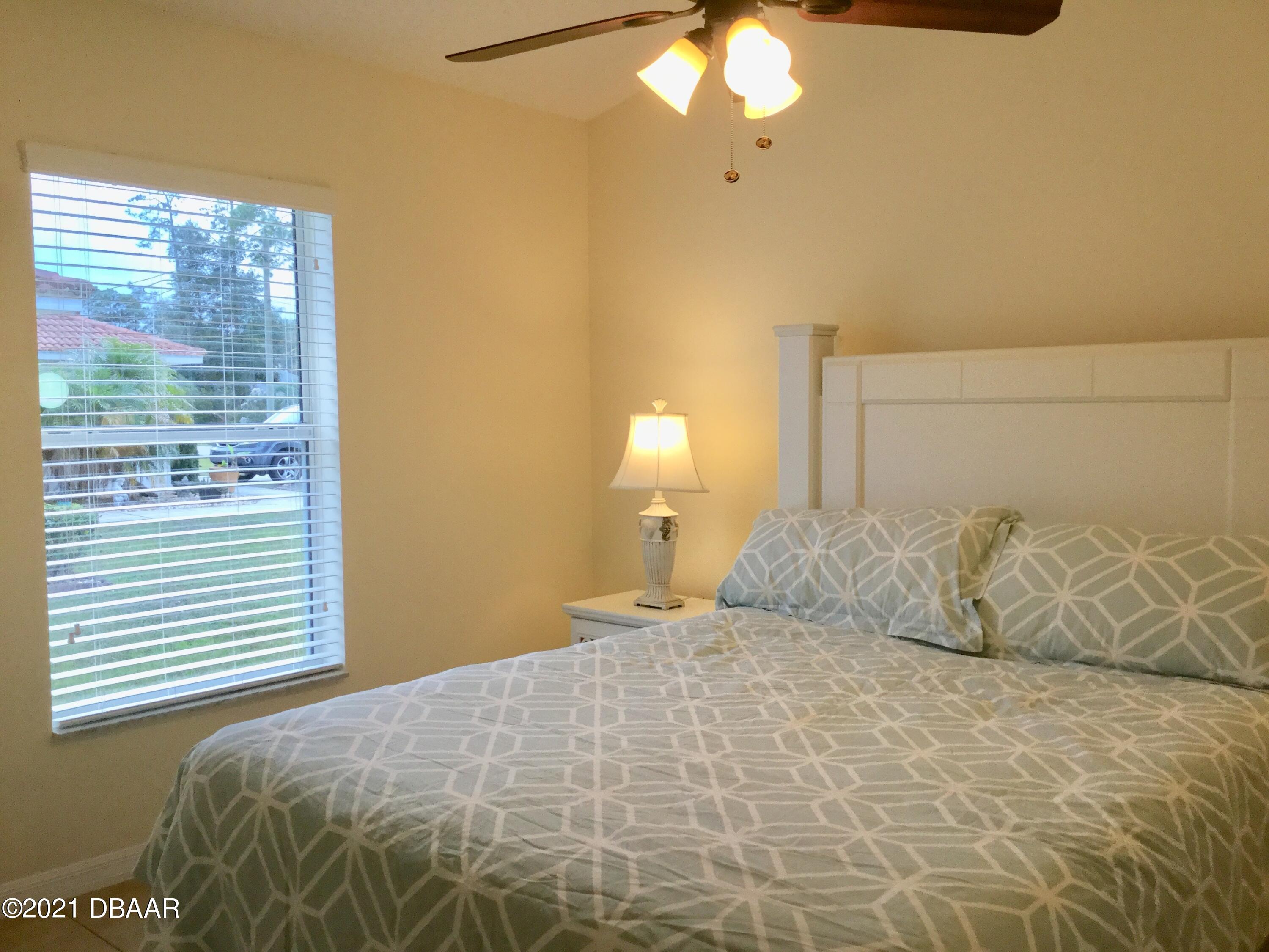 40 Riverside Lane Palm Coast, FL 32164 - Photo 45 of 47 a bedroom with a bed and a window