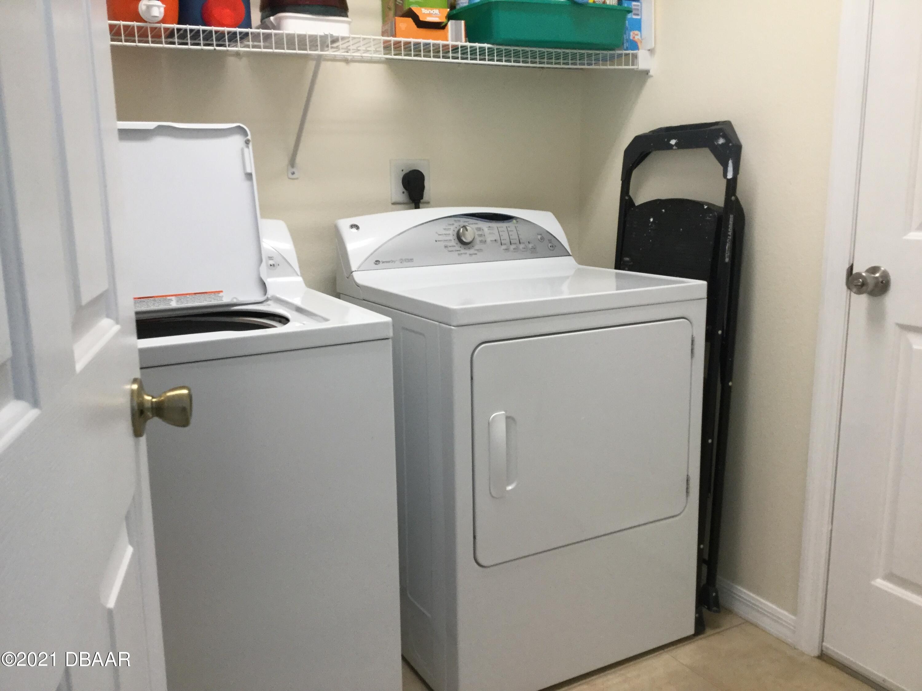 40 Riverside Lane Palm Coast, FL 32164 - Photo 47 of 47 a utility room with dryer and washer