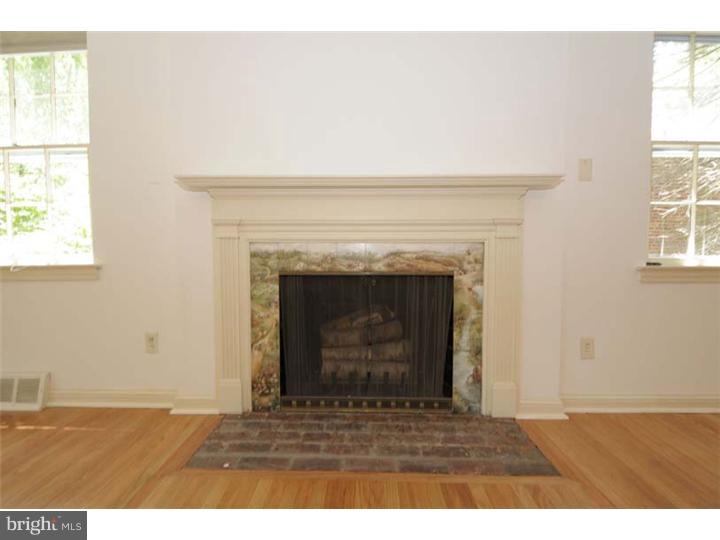 237 Hamilton Road Merion Station, PA 19066 - Photo 3 of 17 a view of an empty room with a fireplace and a window