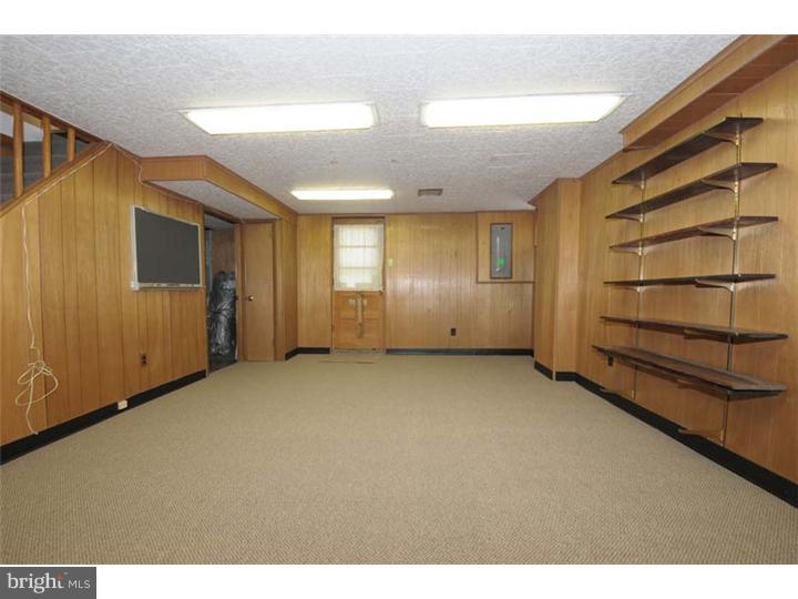 237 Hamilton Road Merion Station, PA 19066 - Photo 8 of 17 a view of an empty room with wooden floor and windows
