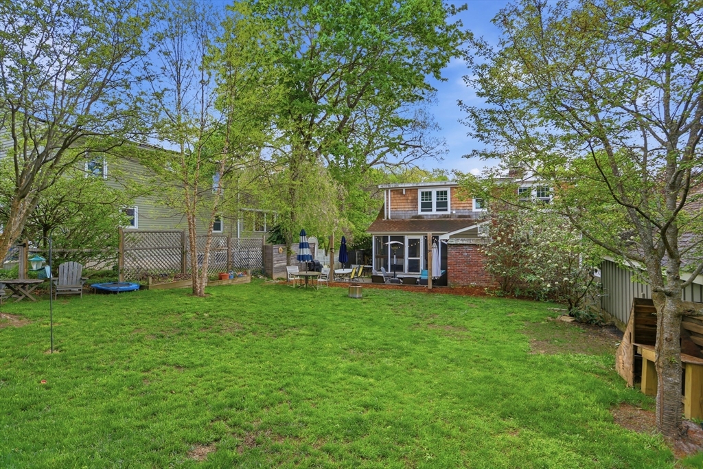 80 Concord Street Maynard, MA 01754 - Photo 26 of 29 a view of a house with a big yard next to a big yard