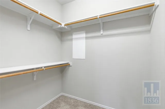 a view of a room with racks on the wall