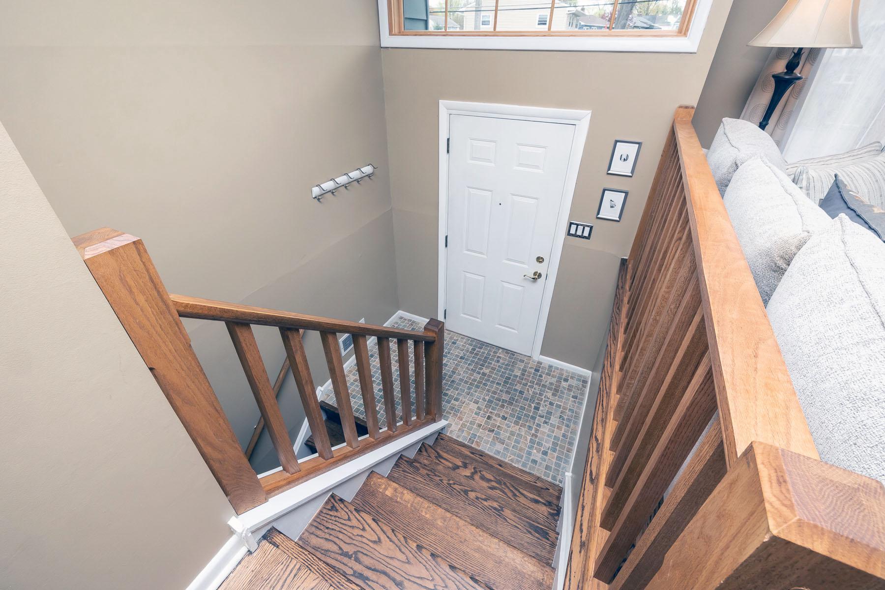 25 Greenvale Road Cherry Hill, NJ 08034 - Photo 15 of 28 Pretty Wood Banister in entryway with warm tones.