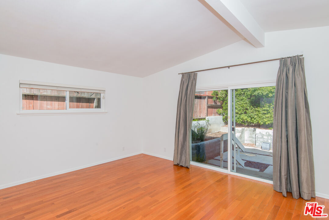 8531 Walnut Drive Los Angeles, CA 90046 - Photo 13 of 17 a room with a window and a bed