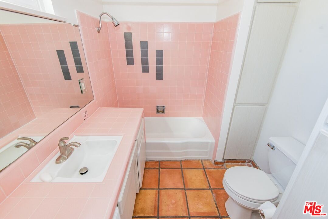 8531 Walnut Drive Los Angeles, CA 90046 - Photo 15 of 17 a bathroom with a sink a toilet and shower
