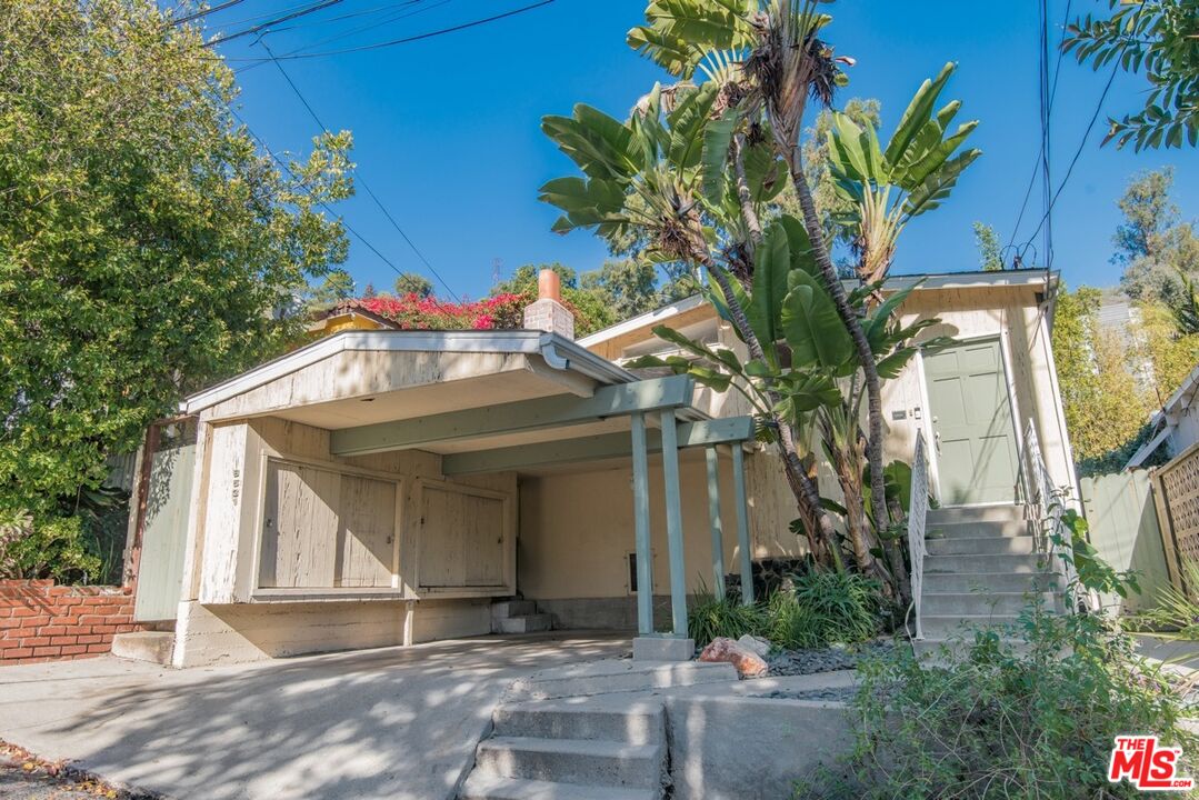 8531 Walnut Drive Los Angeles, CA 90046 - Photo 2 of 17 a front view of a house with a tree