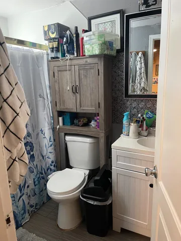 a bathroom with a toilet and a sink