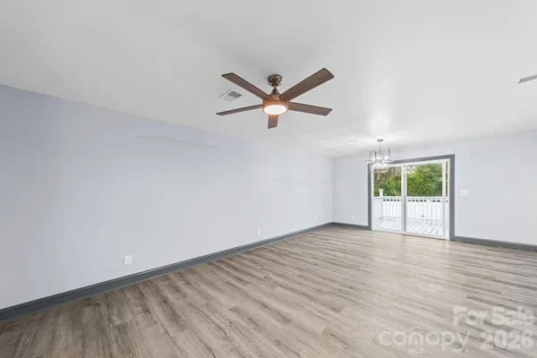 a kitchen with granite countertop kitchen island stainless steel appliances a sink a stove a refrigerator a sink and a refrigerator