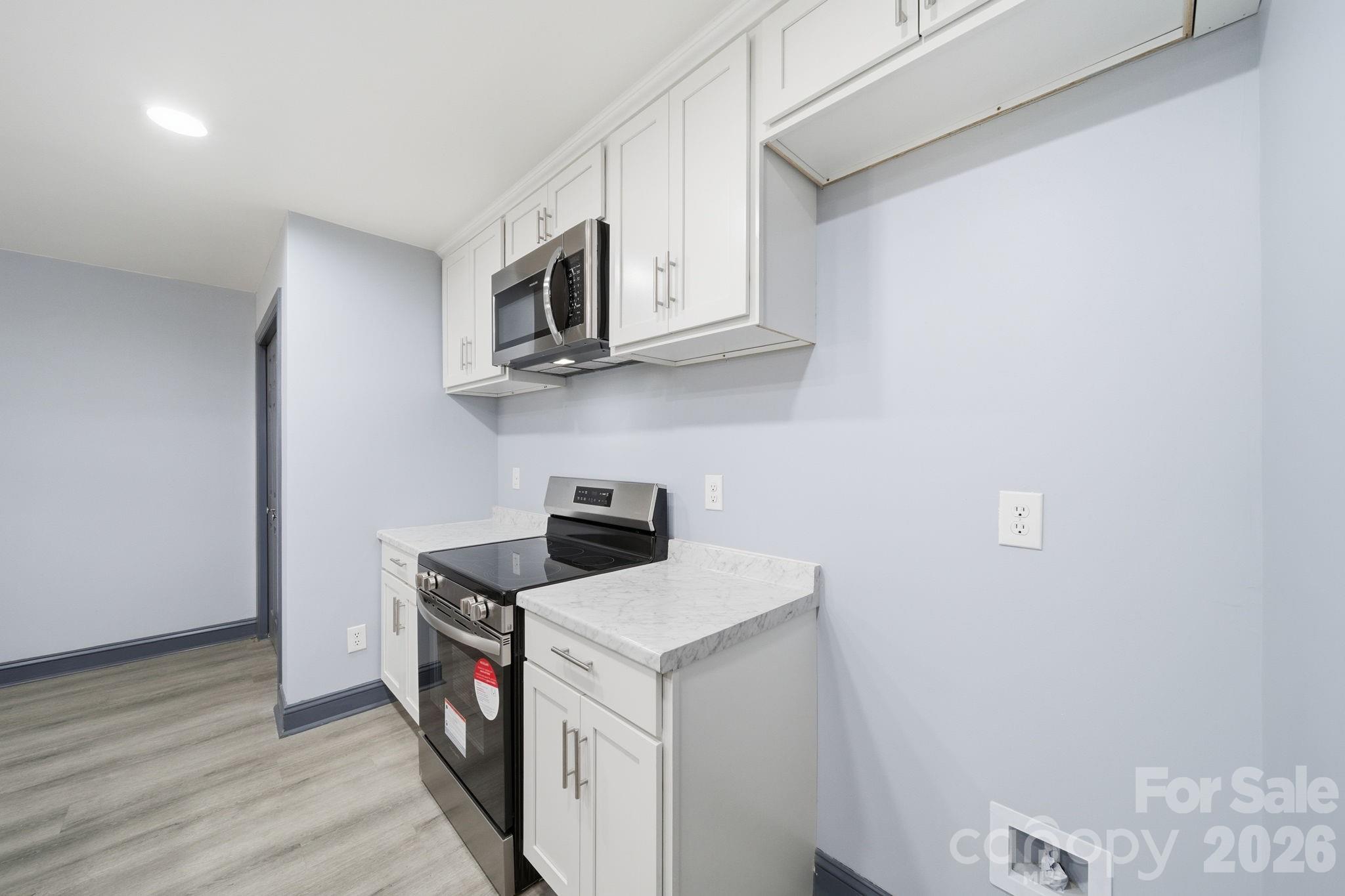 109 Haddock Road Northwest Orangeburg, SC 29115 - Photo 28 of 48 a utility room with cabinets washer and dryer