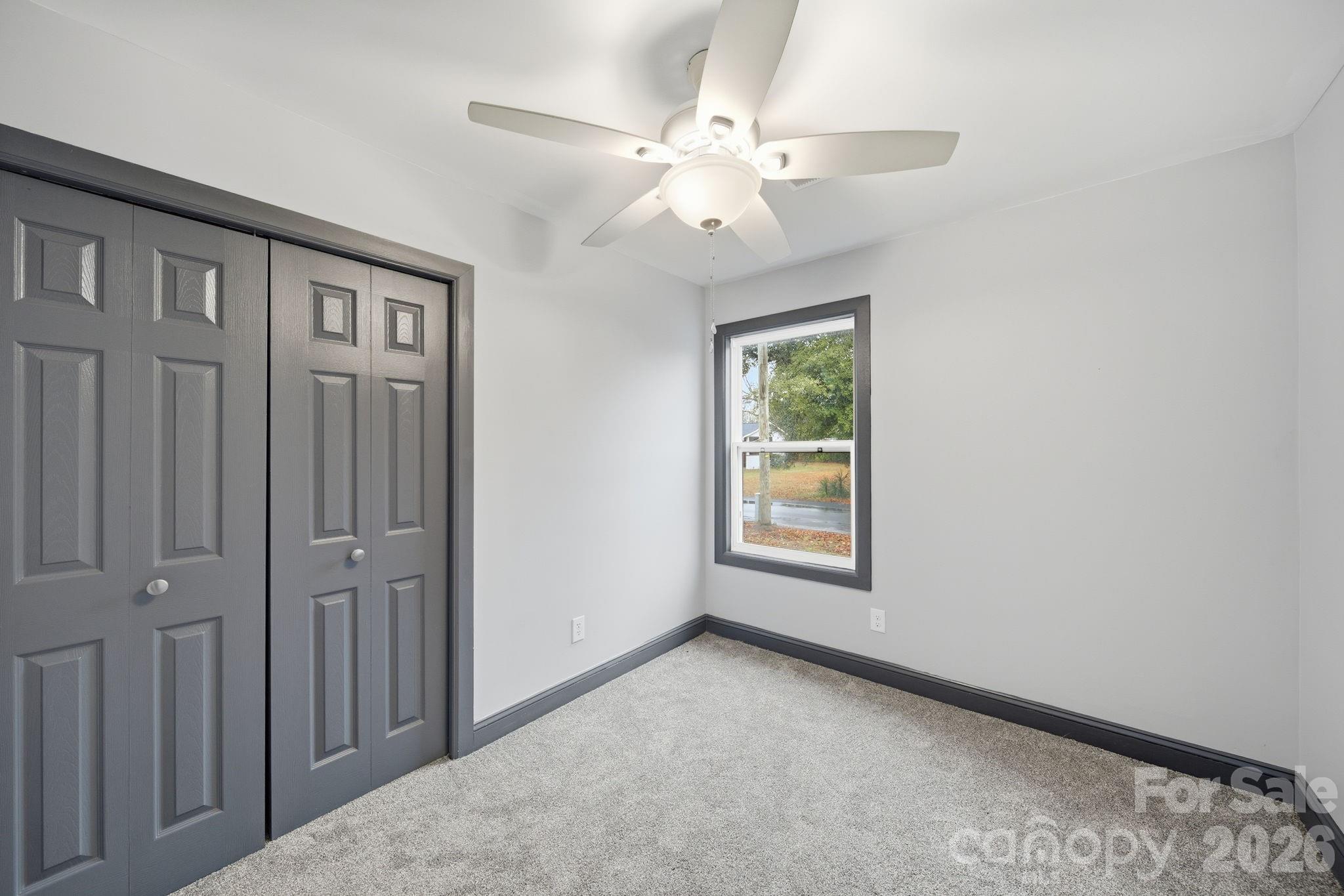 109 Haddock Road Northwest Orangeburg, SC 29115 - Photo 29 of 48 an empty room with windows and fan