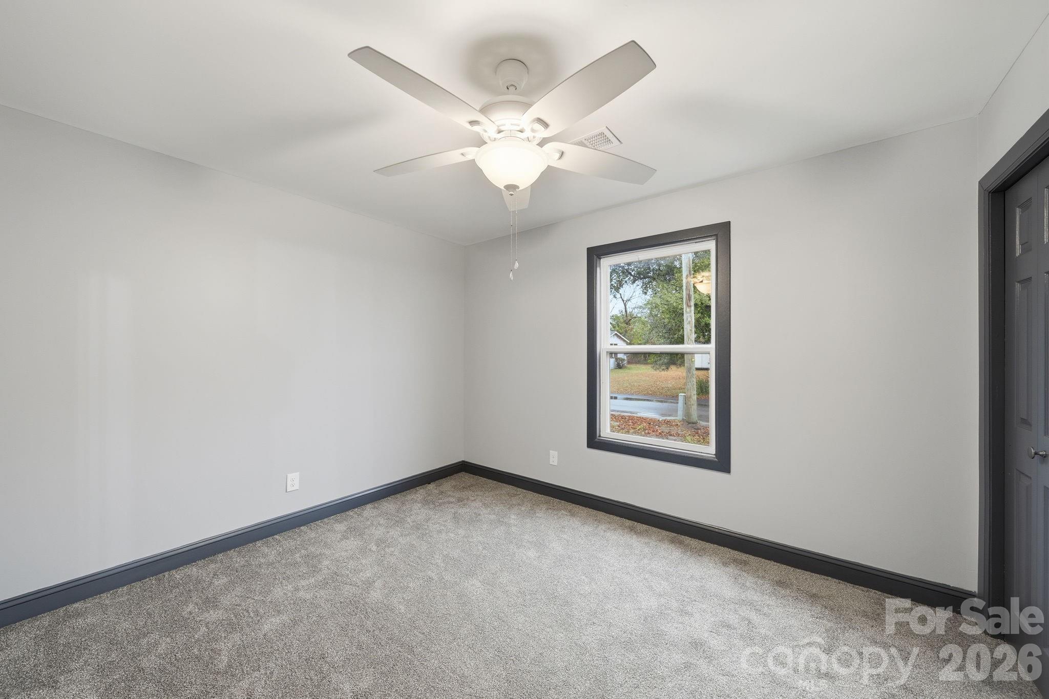 109 Haddock Road Northwest Orangeburg, SC 29115 - Photo 33 of 48 an empty room with windows and fan