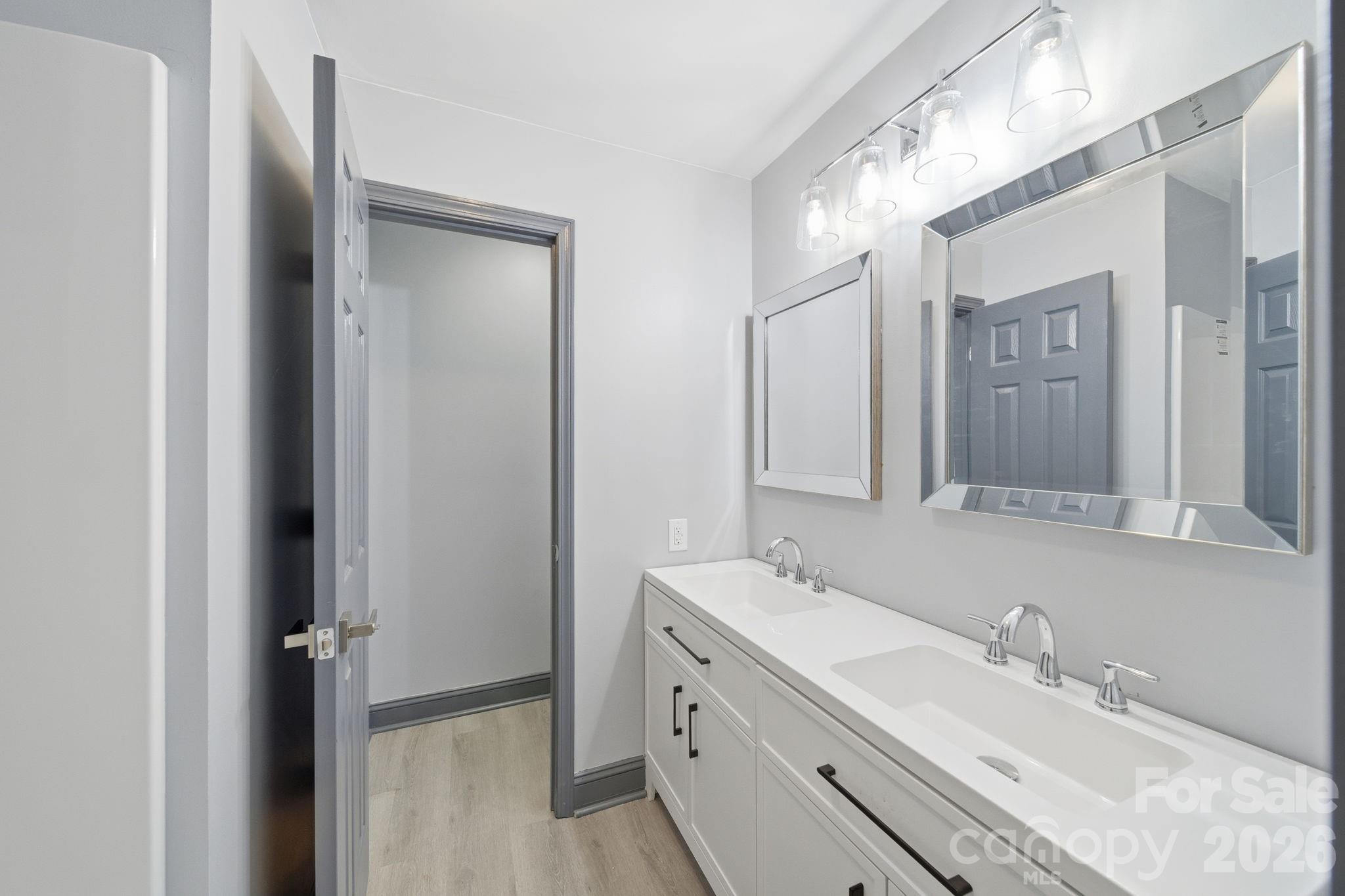 109 Haddock Road Northwest Orangeburg, SC 29115 - Photo 42 of 48 a bathroom with double vanity sink and a mirror