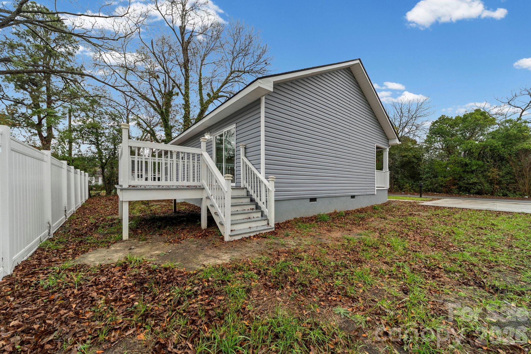 109 Haddock Road Northwest Orangeburg, SC 29115 - Photo 7 of 48 a view of a house with a yard and deck