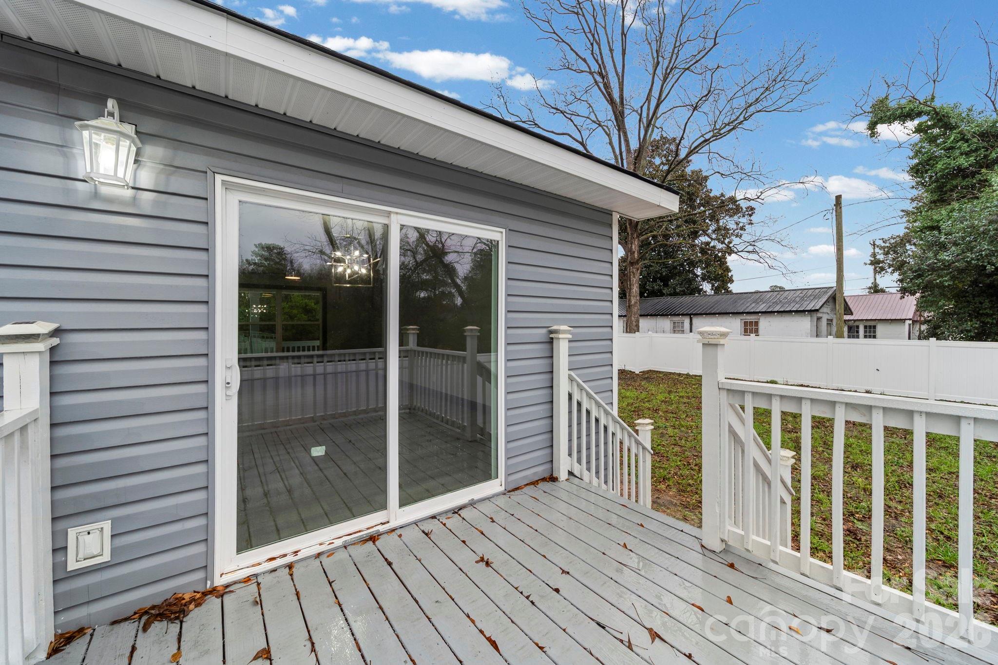 109 Haddock Road Northwest Orangeburg, SC 29115 - Photo 10 of 48 a view of a balcony with wooden floor and fence