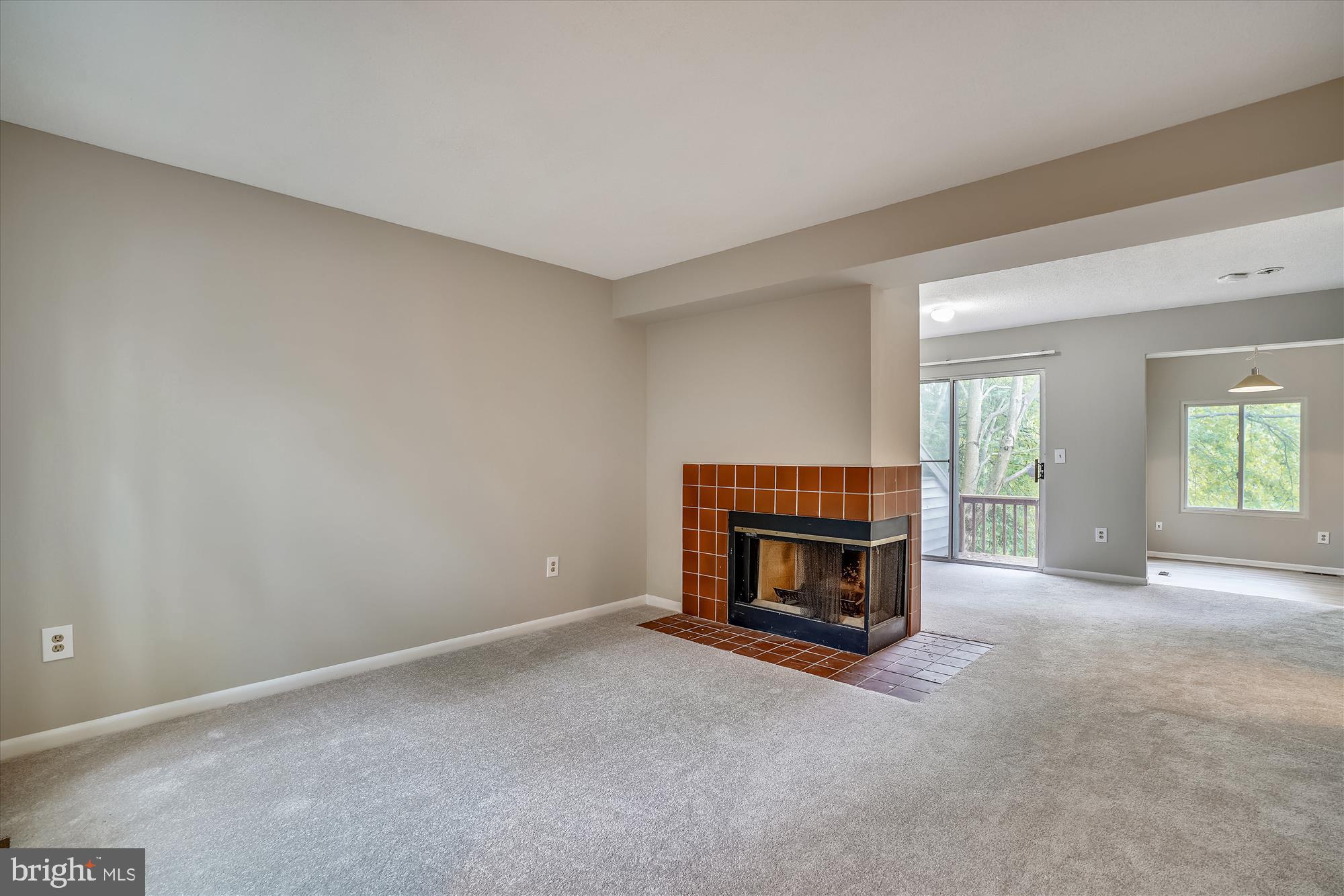 Lovely living room with wood burning fireplace