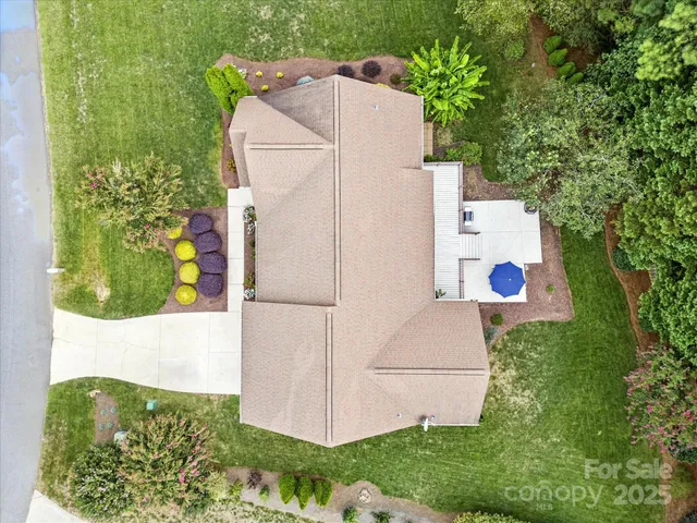 a aerial view of a house with a yard