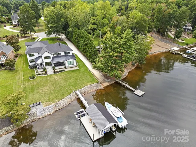 an aerial view of a house with a ocean view
