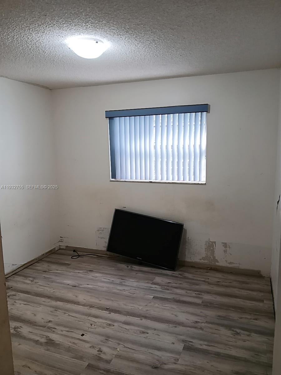 10210 Southwest 175th Street Miami, FL 33157 - Photo 11 of 14 a room with a window