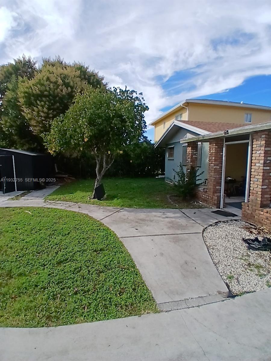 10210 Southwest 175th Street Miami, FL 33157 - Photo 14 of 14 a view of backyard with green space