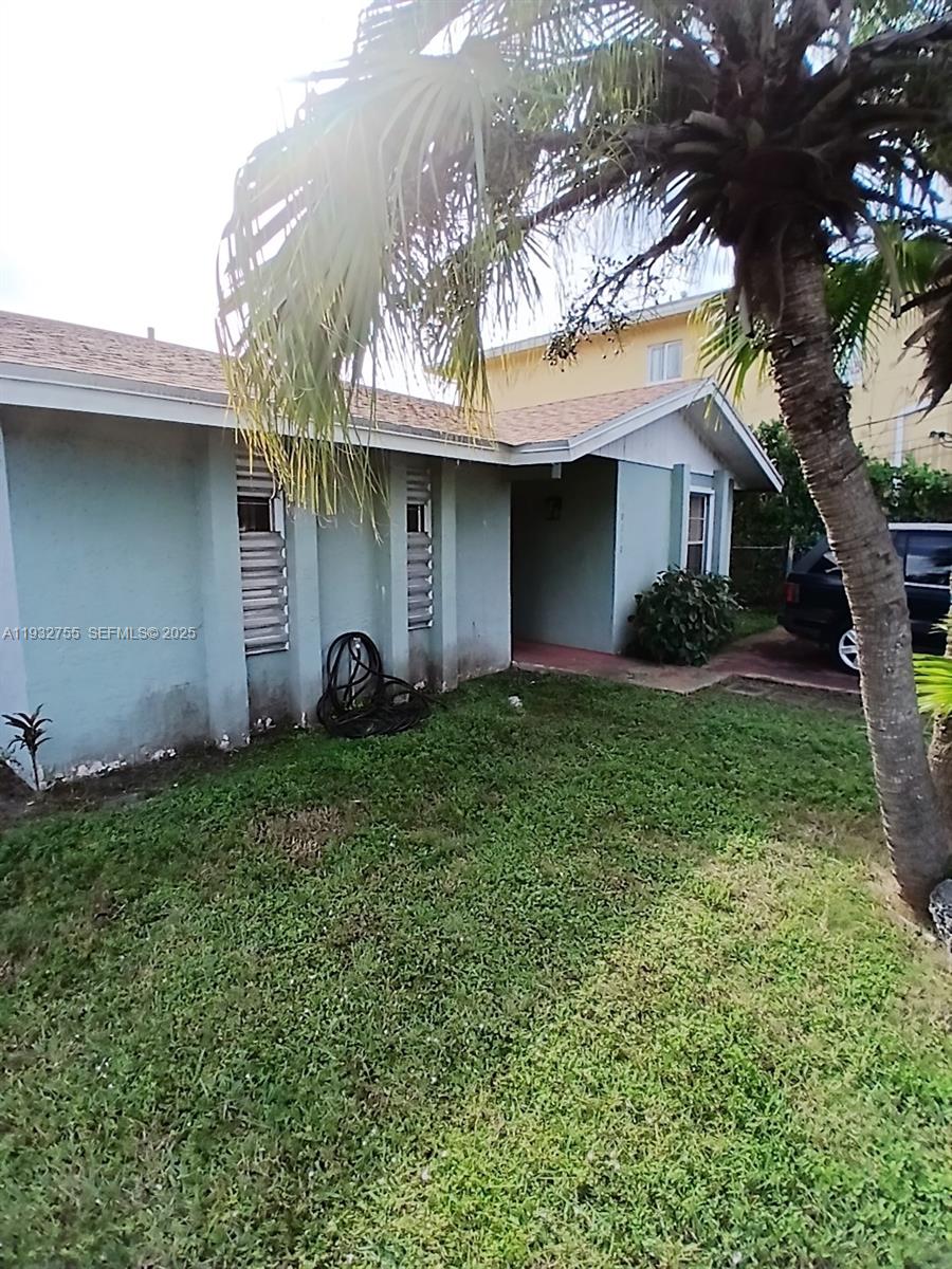 10210 Southwest 175th Street Miami, FL 33157 - Photo 3 of 14 a house view with a garden space
