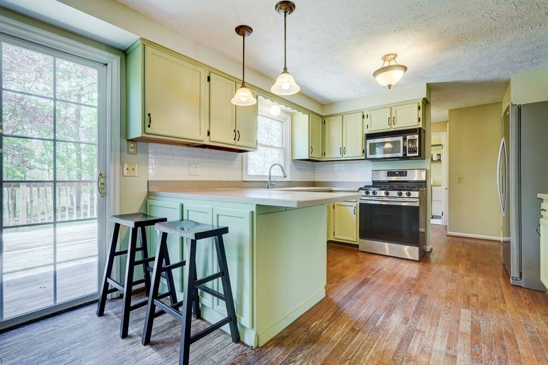 44 Latchmere Drive Victor, NY 14564 - Photo 13 of 50 TASTEFULLY APPOINTED KITCHEN WITH HARDWOOD FLOORIN