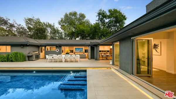 a view of swimming pool with seating space