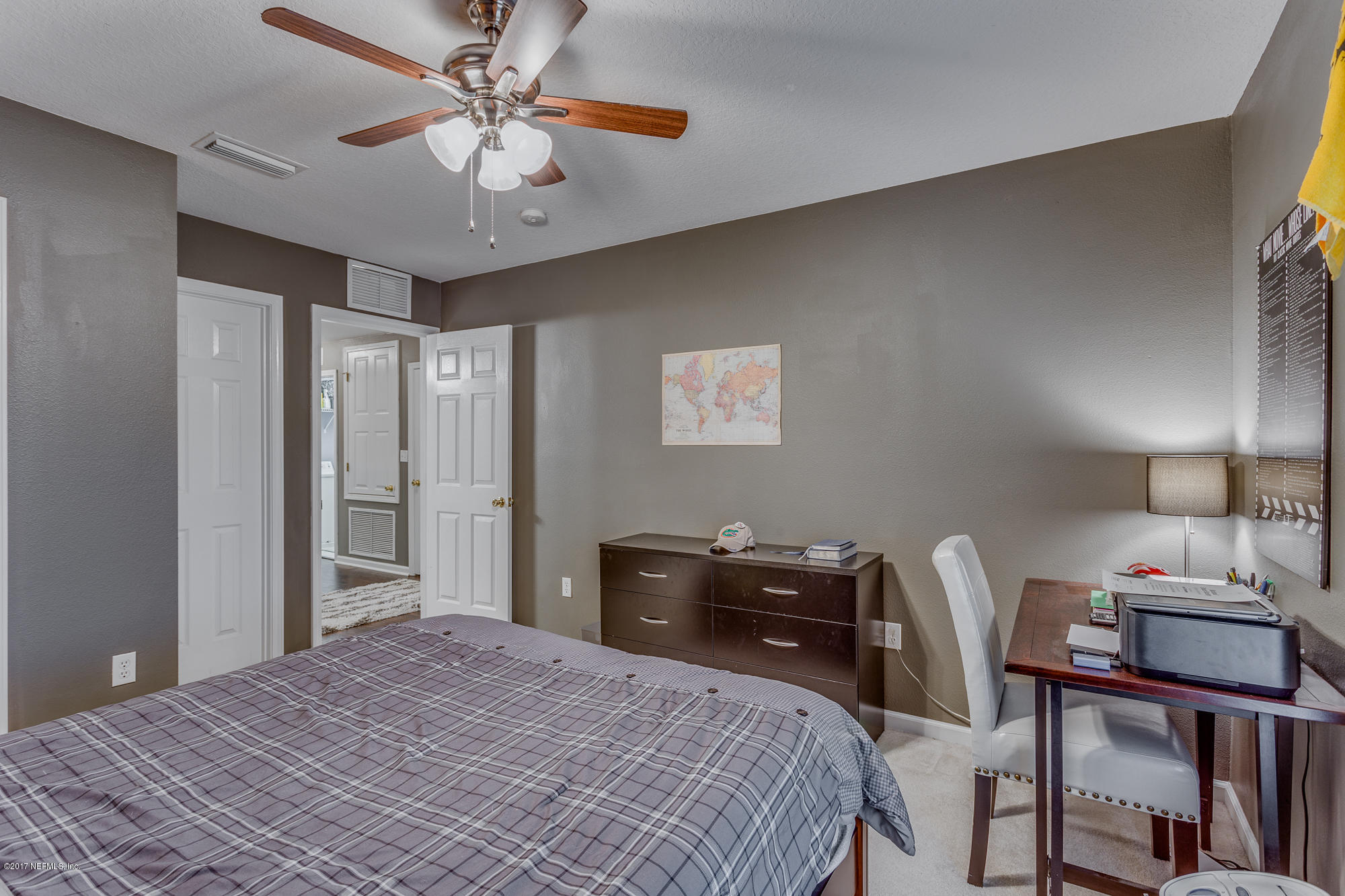 11113 Fallgate Point Court Jacksonville, FL 32256 - Photo 12 of 49 a bedroom with a bed and a chandelier