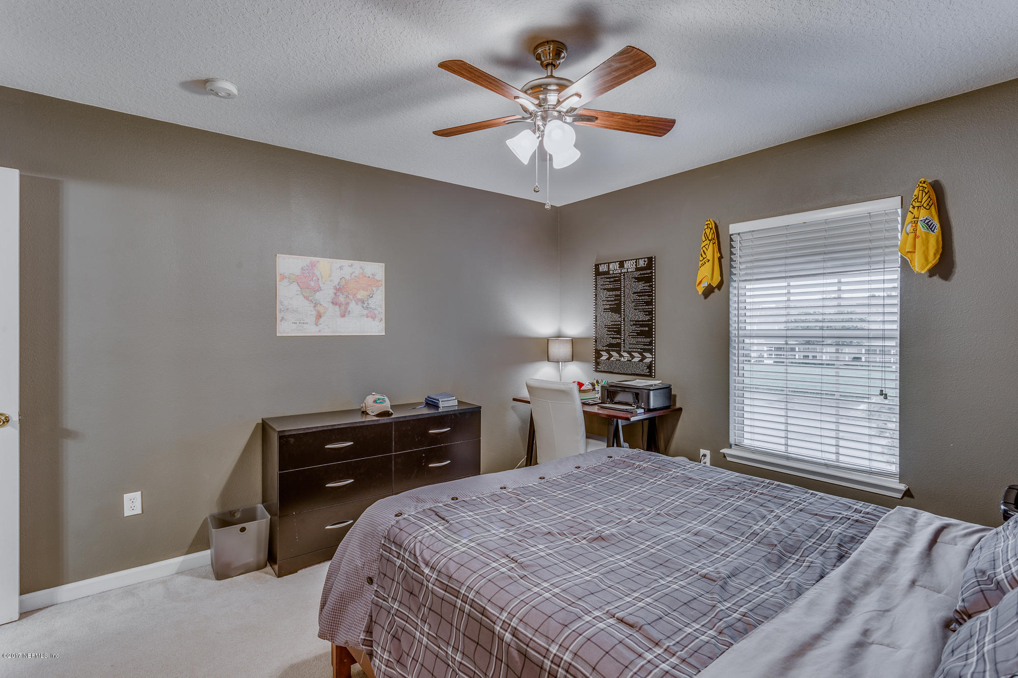 11113 Fallgate Point Court Jacksonville, FL 32256 - Photo 13 of 49 a bedroom with a bed and a chandelier