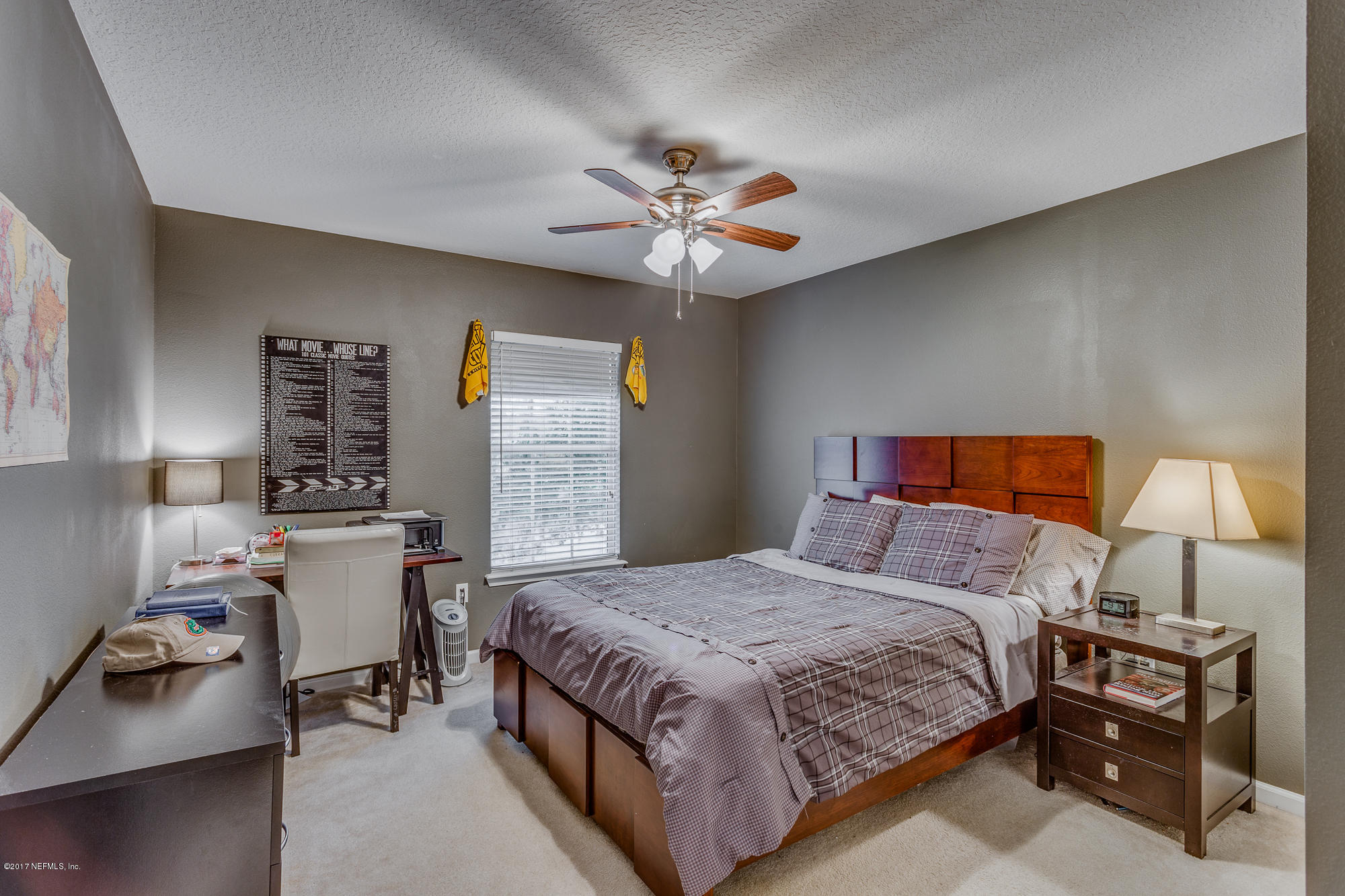 11113 Fallgate Point Court Jacksonville, FL 32256 - Photo 14 of 49 a bedroom with a bed and a table in it