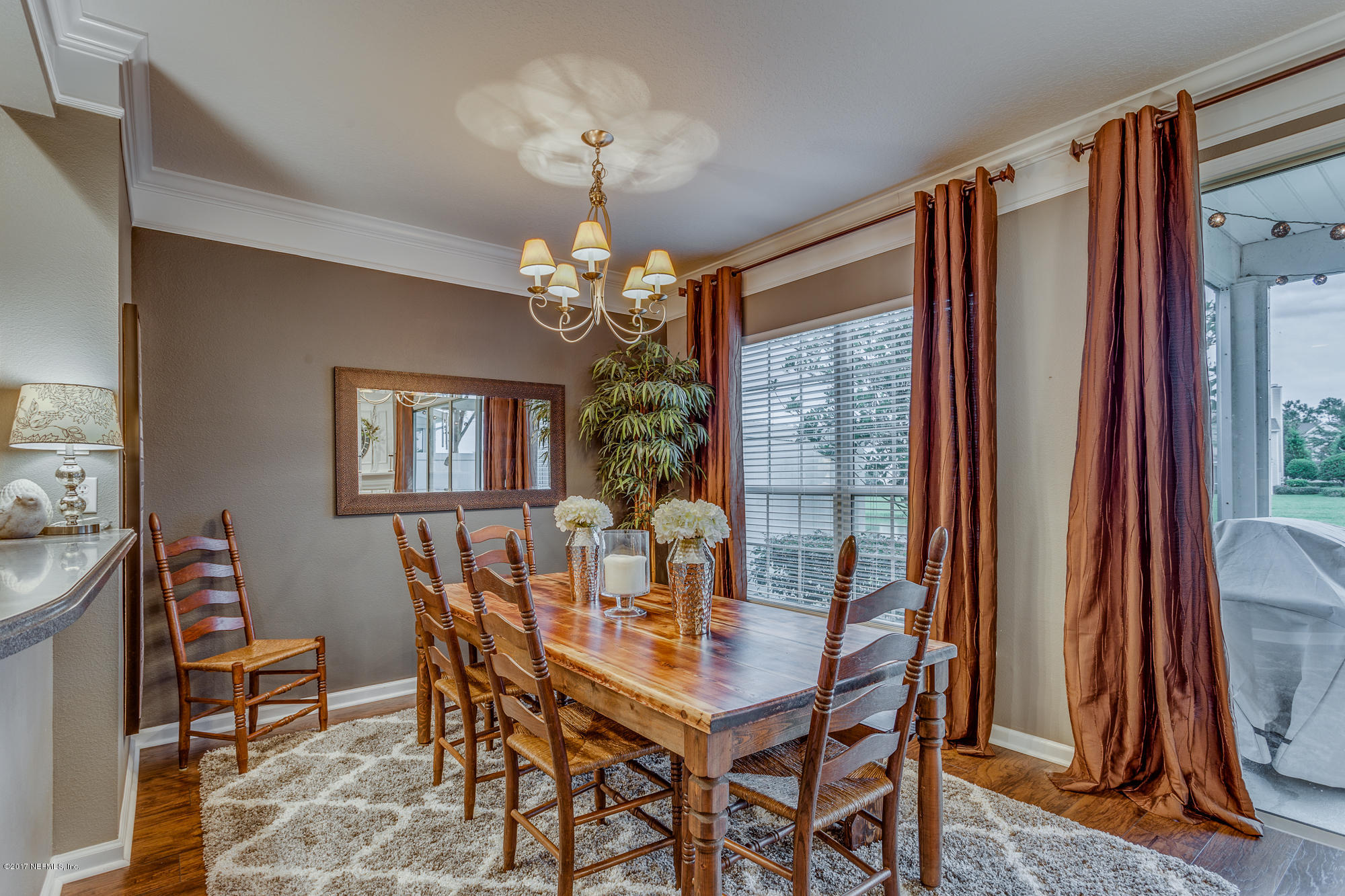 11113 Fallgate Point Court Jacksonville, FL 32256 - Photo 15 of 49 a view of a dining room with furniture and a chandelier