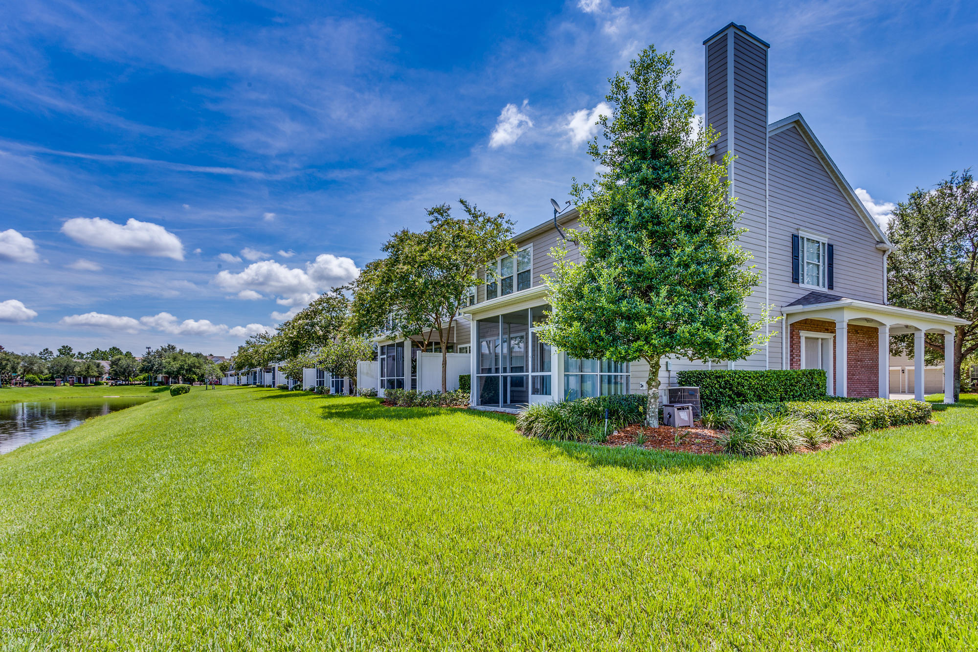 11113 Fallgate Point Court Jacksonville, FL 32256 - Photo 21 of 49 a front view of a house with a garden and yard