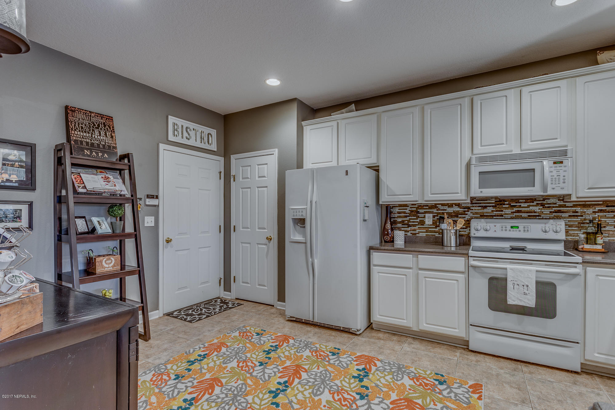 11113 Fallgate Point Court Jacksonville, FL 32256 - Photo 26 of 49 a kitchen with stainless steel appliances granite countertop a refrigerator and a stove top oven