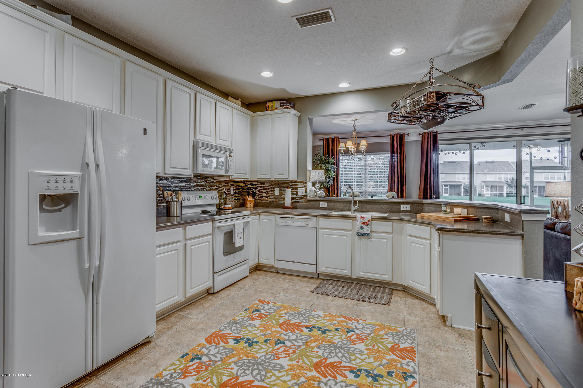 11113 Fallgate Point Court Jacksonville, FL 32256 - Photo 28 of 49 a kitchen with a sink cabinets and window