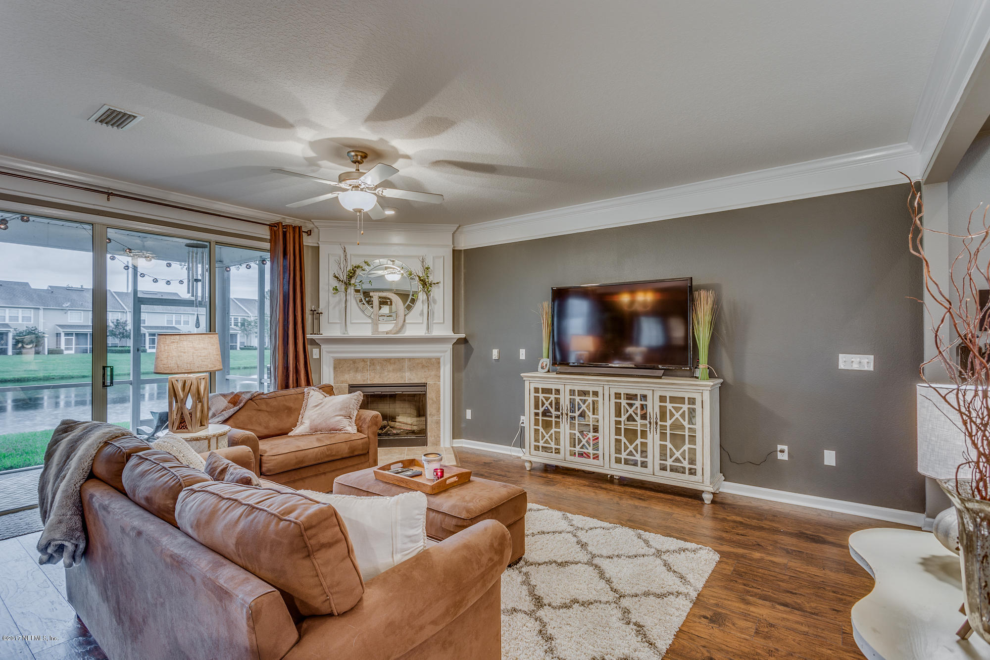 11113 Fallgate Point Court Jacksonville, FL 32256 - Photo 33 of 49 a living room with furniture and a flat screen tv