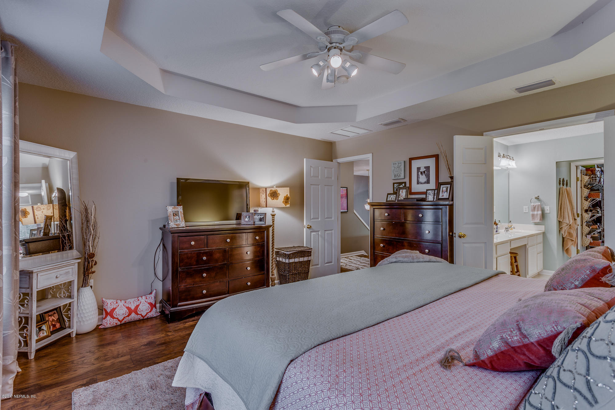 11113 Fallgate Point Court Jacksonville, FL 32256 - Photo 35 of 49 a bedroom with a bed and wooden floor