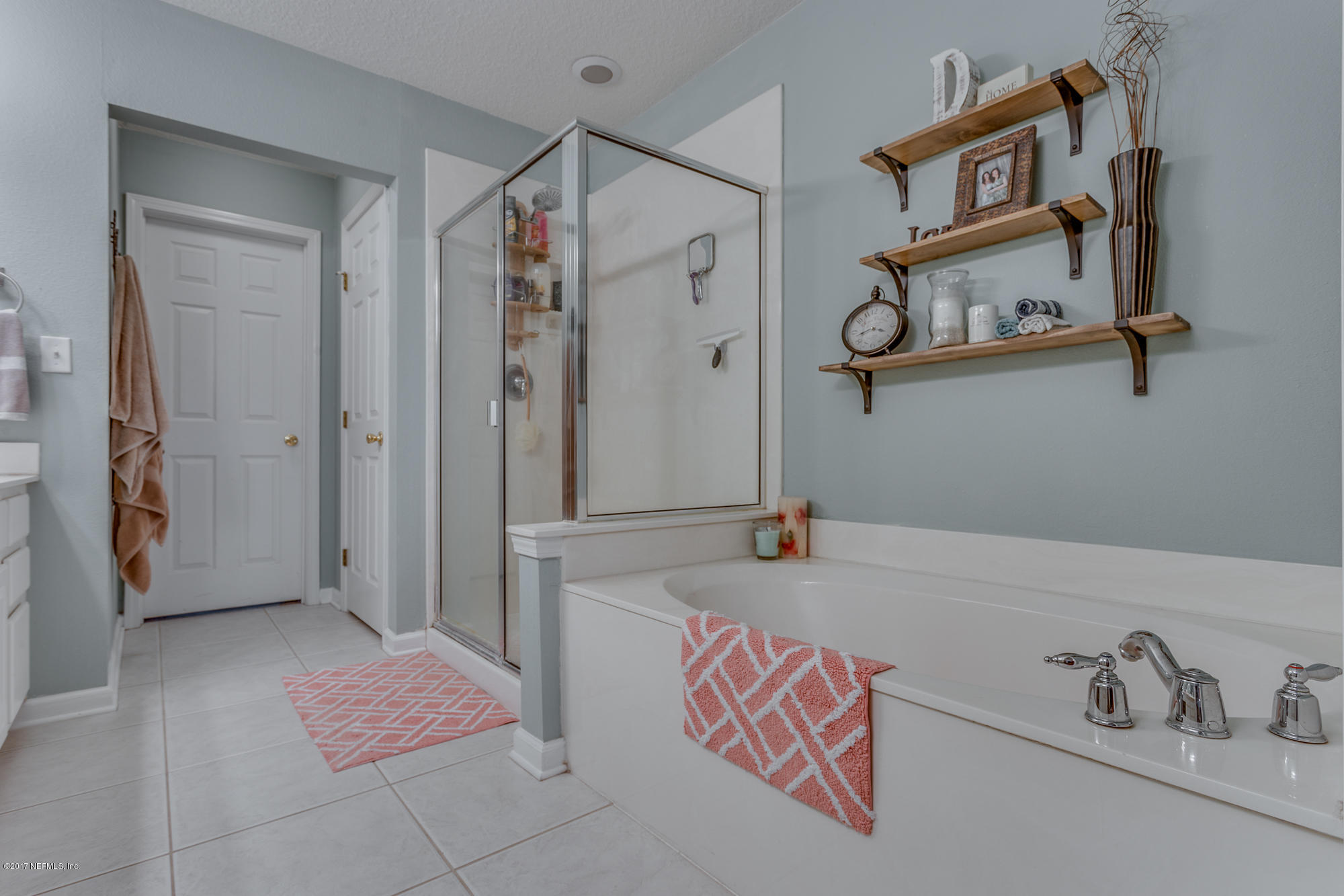 11113 Fallgate Point Court Jacksonville, FL 32256 - Photo 40 of 49 a bathroom with a tub and shower