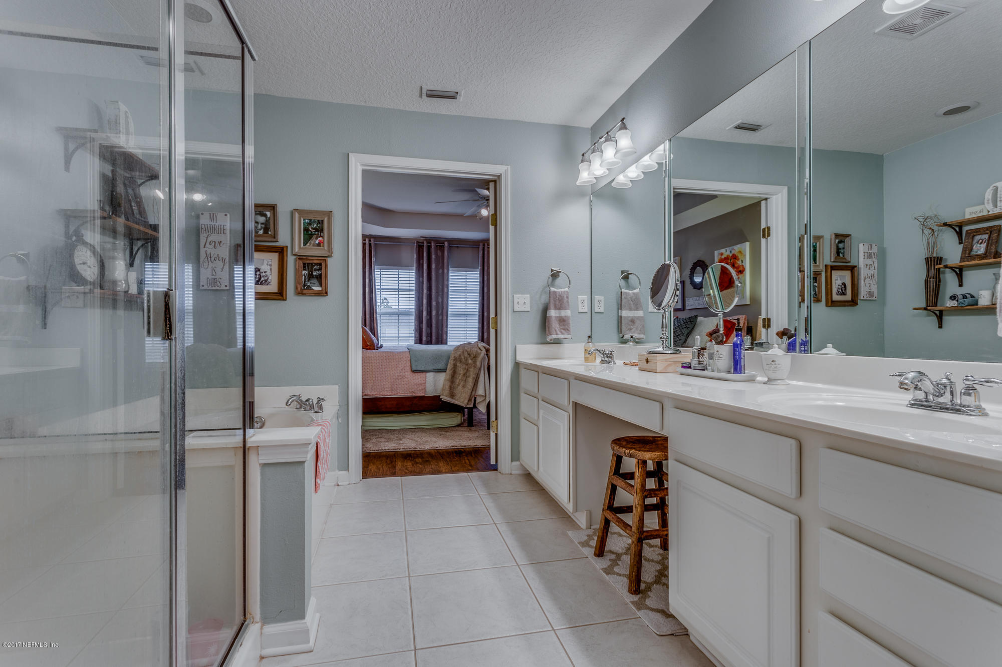 11113 Fallgate Point Court Jacksonville, FL 32256 - Photo 41 of 49 a bathroom with a sink double vanity and shower
