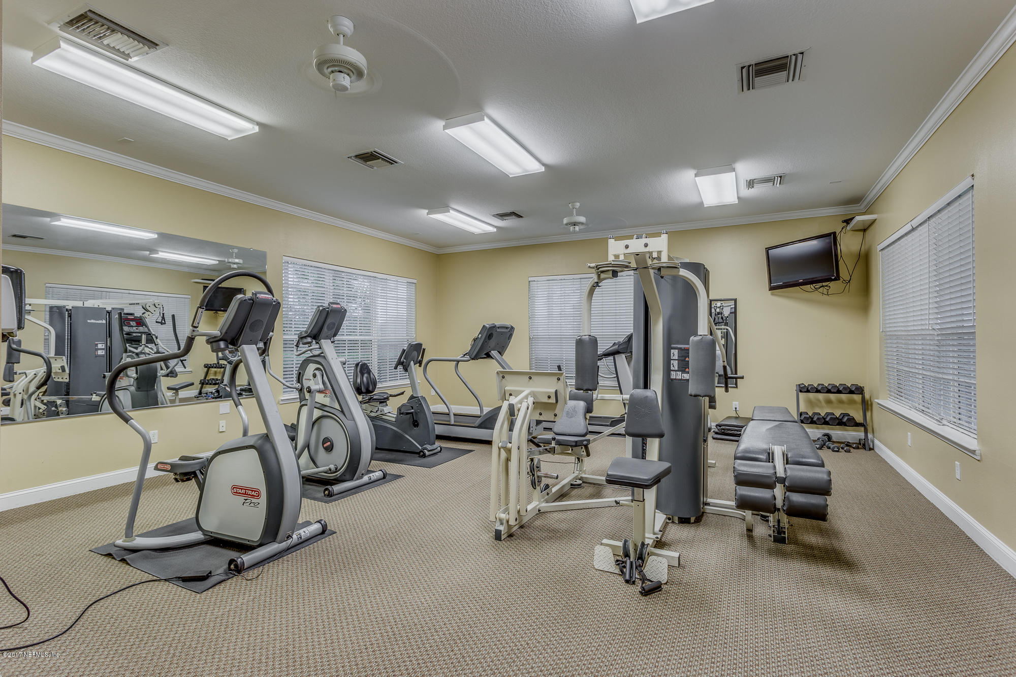 11113 Fallgate Point Court Jacksonville, FL 32256 - Photo 48 of 49 a view of a room with gym equipment