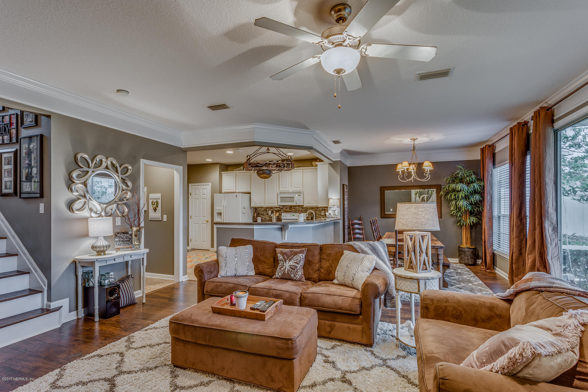 11113 Fallgate Point Court Jacksonville, FL 32256 - Photo 6 of 49 a living room with furniture and a flat screen tv