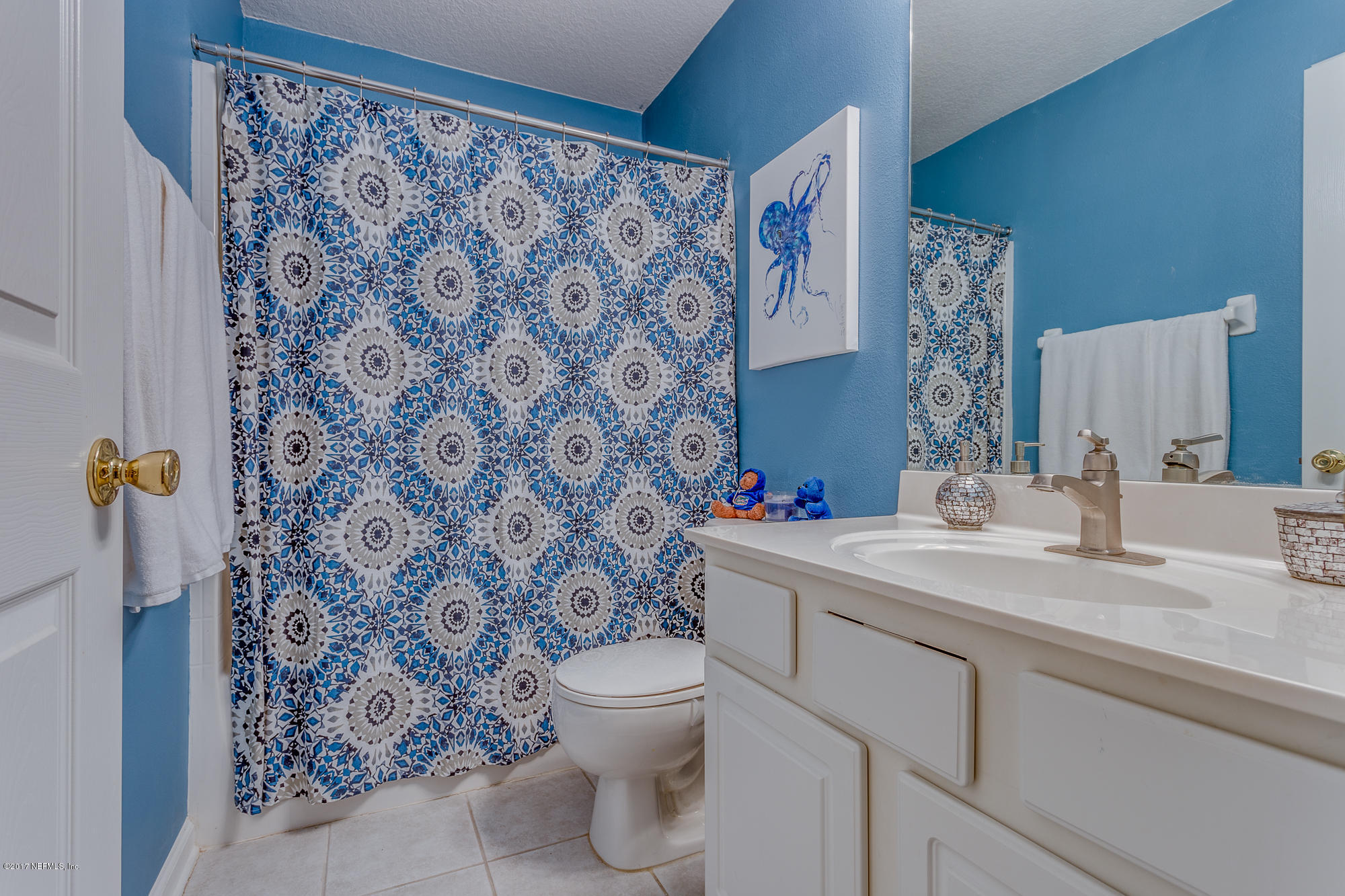 11113 Fallgate Point Court Jacksonville, FL 32256 - Photo 7 of 49 a bathroom with a granite countertop sink a toilet and a mirror