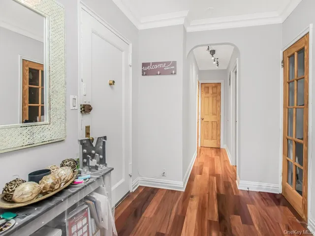 a room with wooden floor and cabinets