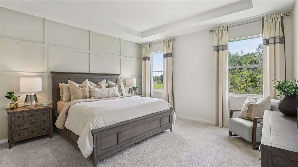 17542 Maple Grv Road Land O Lakes, FL 34638 - Photo 28 of 34 a bed room with a bed and a window