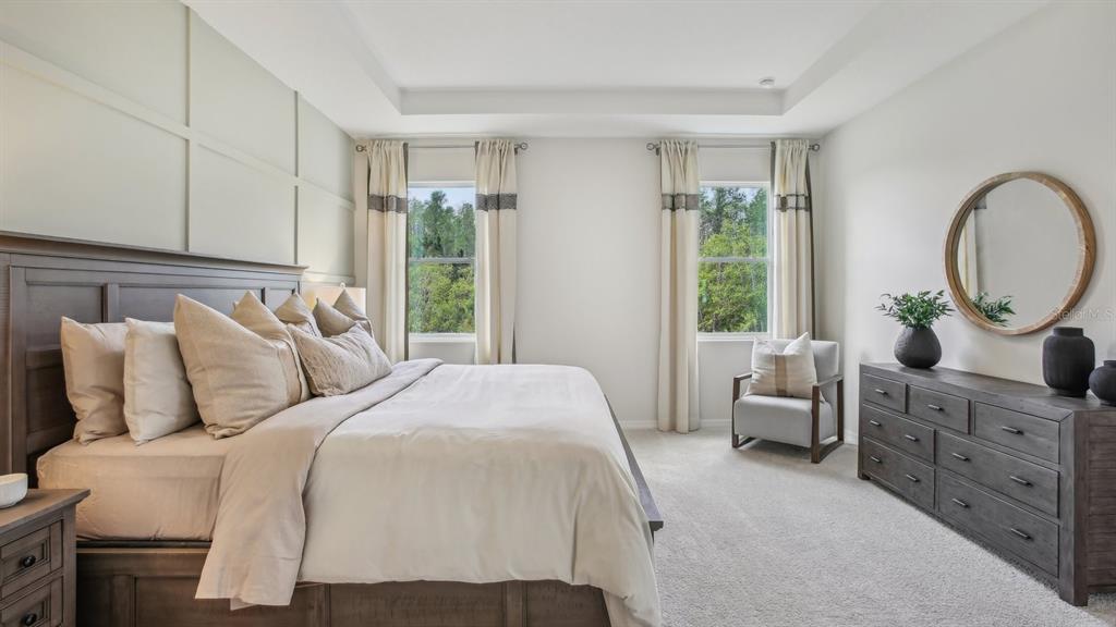 17542 Maple Grv Road Land O Lakes, FL 34638 - Photo 31 of 34 a bedroom with bed and a large window