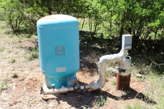 a backyard of a house with a sink and yard