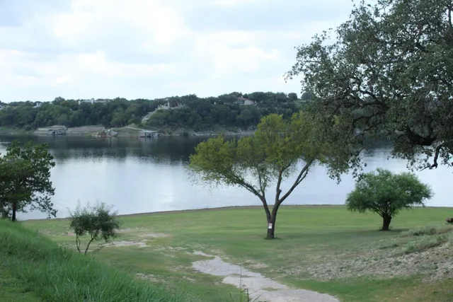 a view of lake with mountain in the background