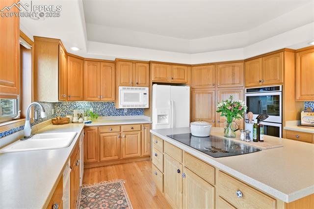 6240 Wilson Road Colorado Springs, CO 80919 - Photo 15 of 42 Huge eat-in kitchen with large island, storage and serving area.