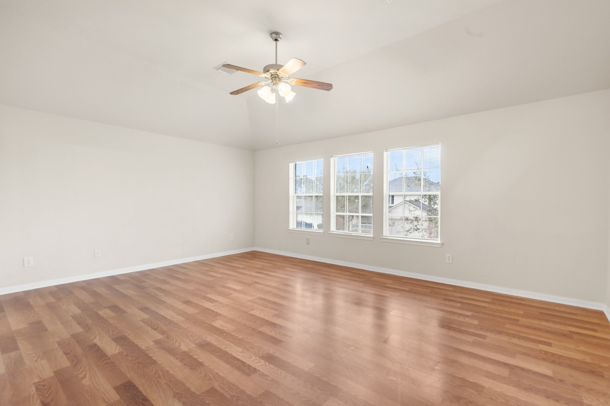 3111 Holly Ranch Drive Katy, TX 77494 - Photo 25 of 28 wooden floor in an empty room with a window