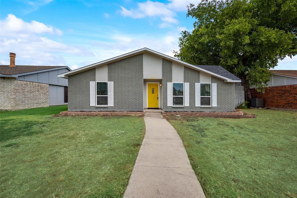 5412 Rice Drive The Colony, TX 75056 - Photo 1 of 17 a front view of house with yard and green space