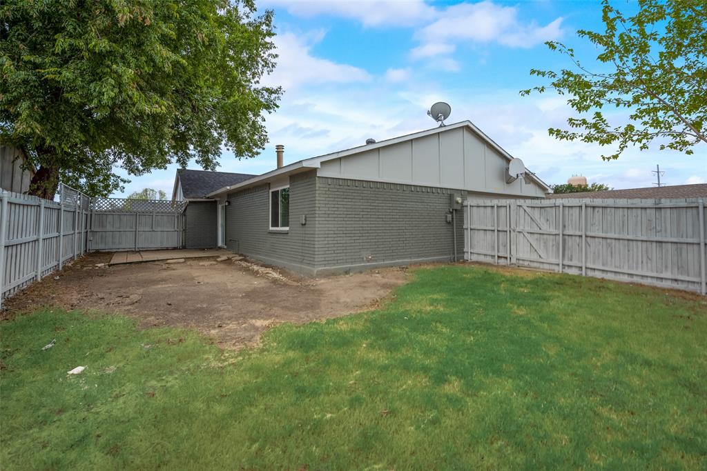 5412 Rice Drive The Colony, TX 75056 - Photo 17 of 17 a backyard of a house with plants and large tree
